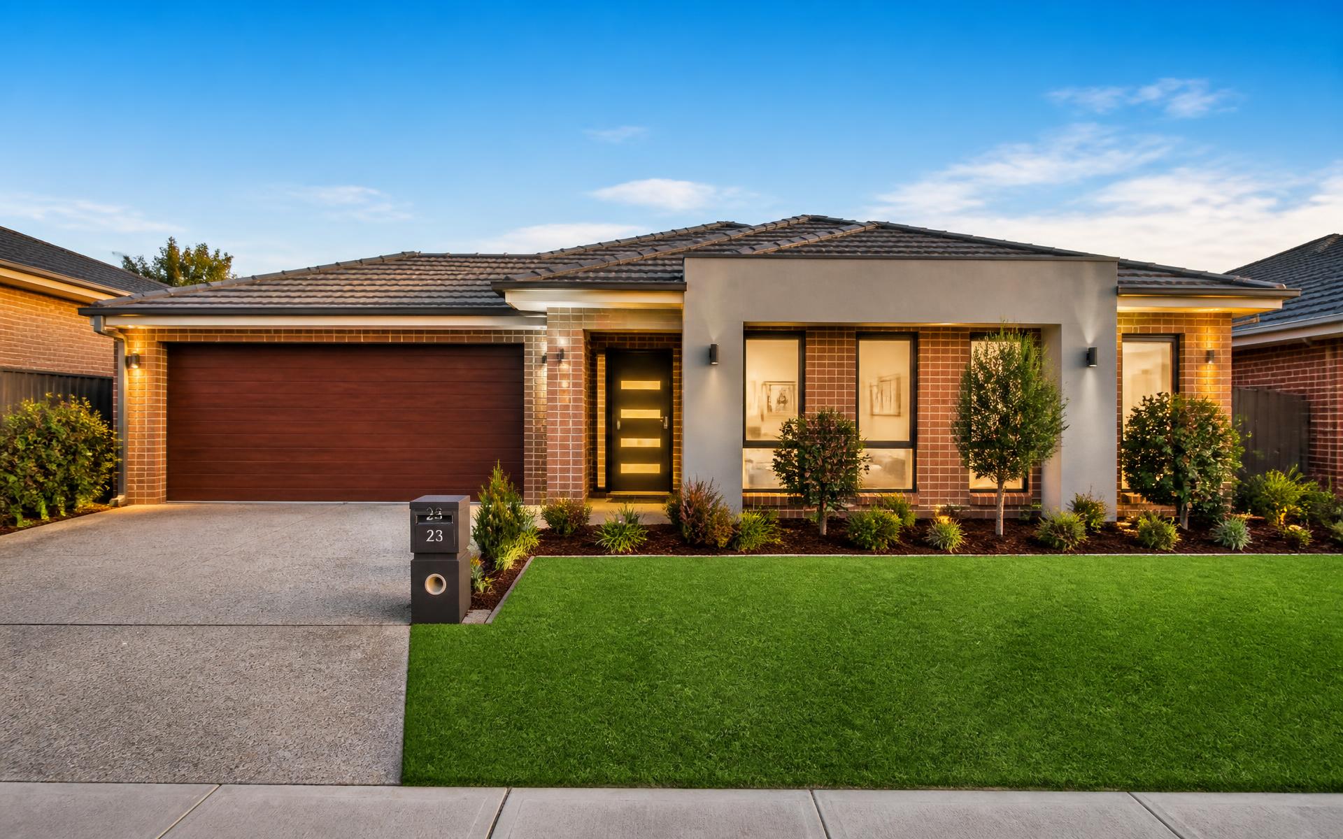 Well-maintained suburban Melbourne home with green lawn and clean driveway